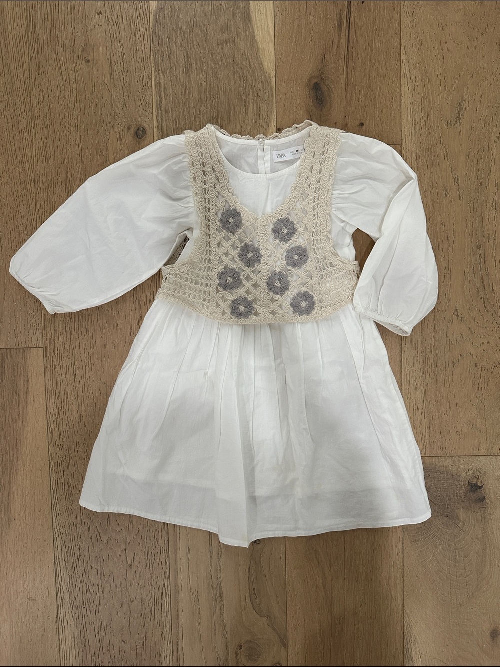 Zara White Dress with Cream Crochet Vest and Gray Floral Accents